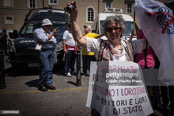 Woman wearing poster during protest against CONSOB in Rome. The "victims of saving banks' protest against the Commissione Nazionale per le Società e...