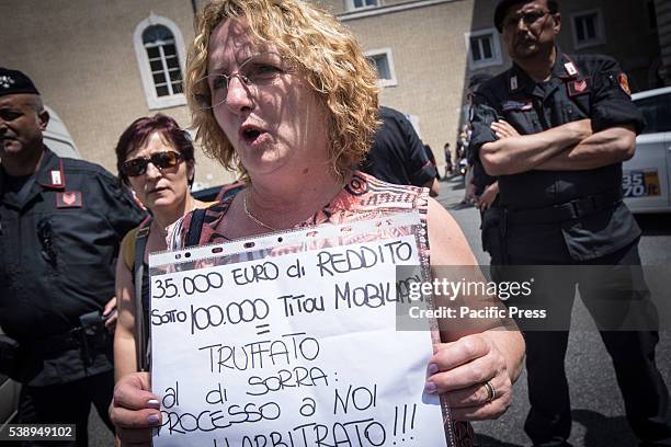 Woman holding a poster during protest against CONSOB in Rome. The "victims of saving banks' protest against the Commissione Nazionale per le Società...