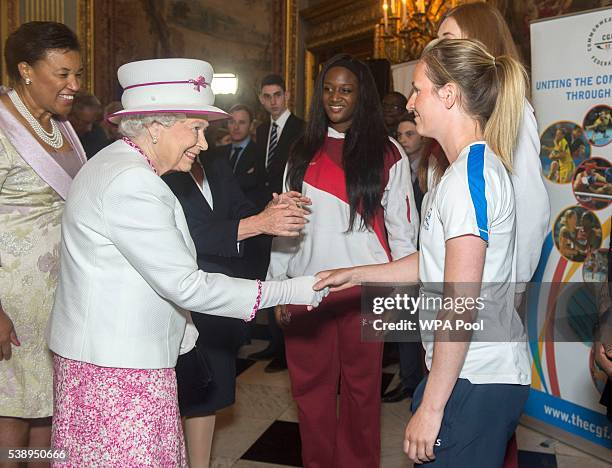 Queen Elizabeth II meets Commonwealth Games Hockey athlete Ali Bell at Marlborough House as she launches Commonwealth Hub which brings Commonwealth...