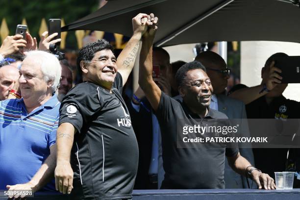 Former Argentinian football international Diego Maradona and former Brazilian footballer Pele attend a football match organised by Swiss luxury...