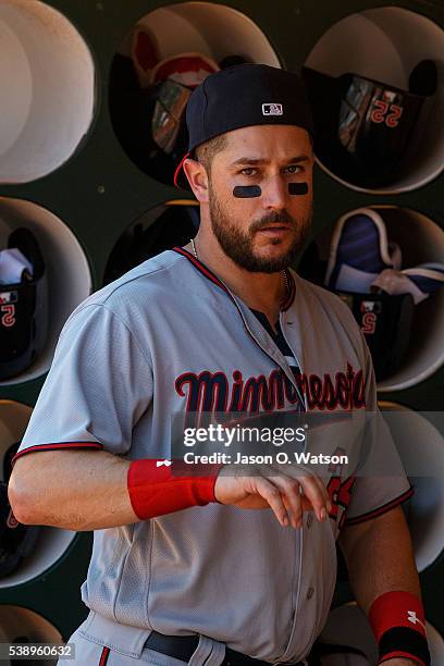 Trevor Plouffe of the Minnesota Twins stands in the dugout before the game against the Oakland Athletics at the Oakland Coliseum on June 1, 2016 in...