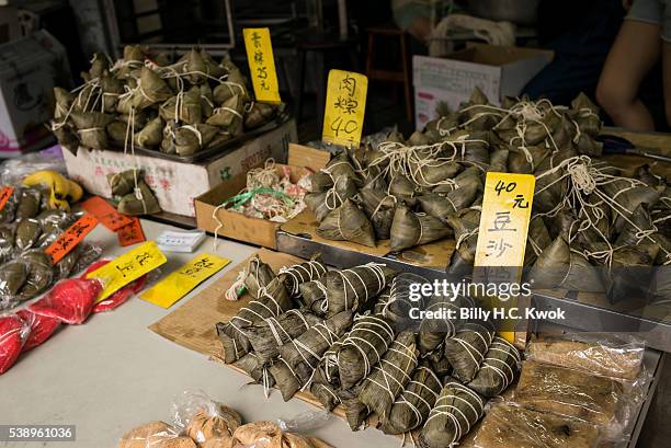 Rice dumplings are sold during a dragon boat race held to celebrate the Dragon Boat Festival on June 9, 2016 in Taipei, Taiwan. Cities across Asia...