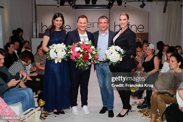 German fashion designer Guido Maria Kretschmer and CEO of Heinrich Heine GmbH Juergen Habermann with models during the Guido Maria Kretschmer...