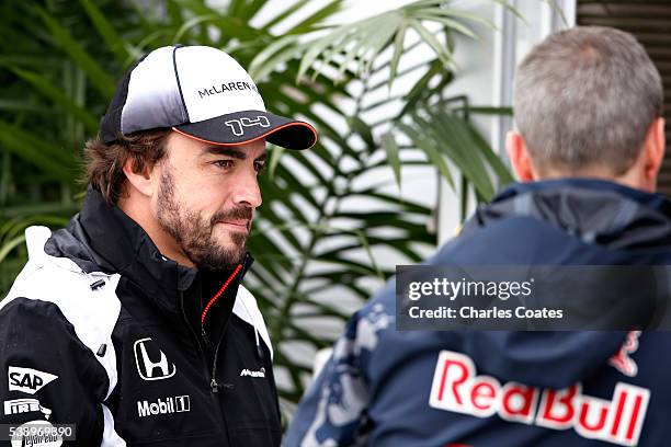 Fernando Alonso of Spain and McLaren Honda talks with Red Bull Racing Head of Car Engineering Paul Monaghan in the Paddock during previews to the...