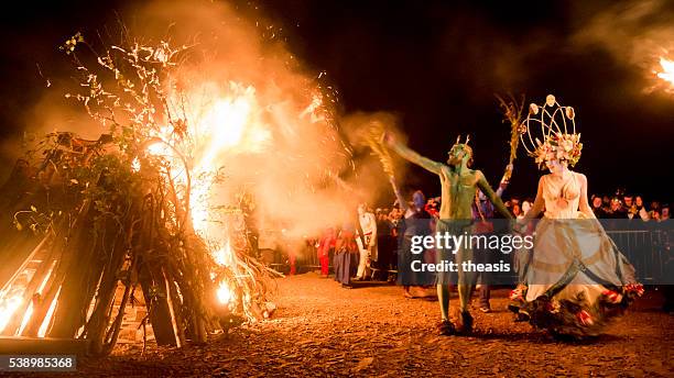 may queen and green man at the beltane fire festival - bonfire stock pictures, royalty-free photos & images