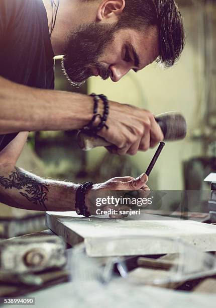 stonecutter portrait at work - sculptor stock pictures, royalty-free photos & images