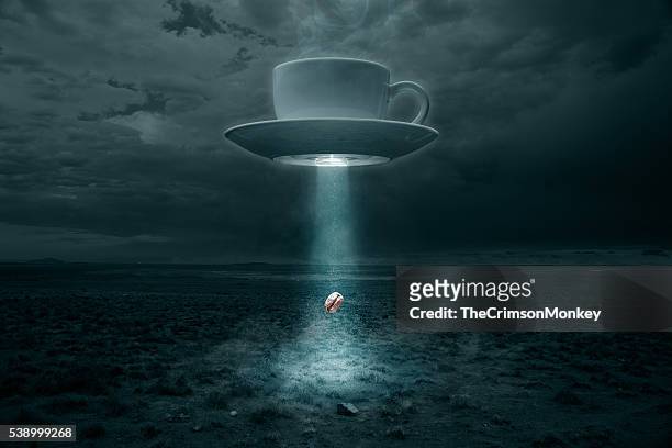 flying cup and saucer abducting a coffee bean - flying saucer stock pictures, royalty-free photos & images