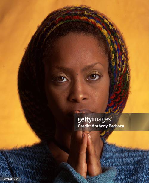 Close-up portrait of American R&B, jazz, and pop singer Erykah Badu , New York, 2000.