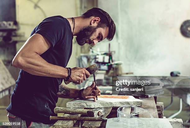 stonecutter portrait at work - stone sculptor stock pictures, royalty-free photos & images
