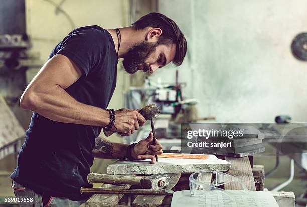 stonecutter portrait at work - mason stock pictures, royalty-free photos & images