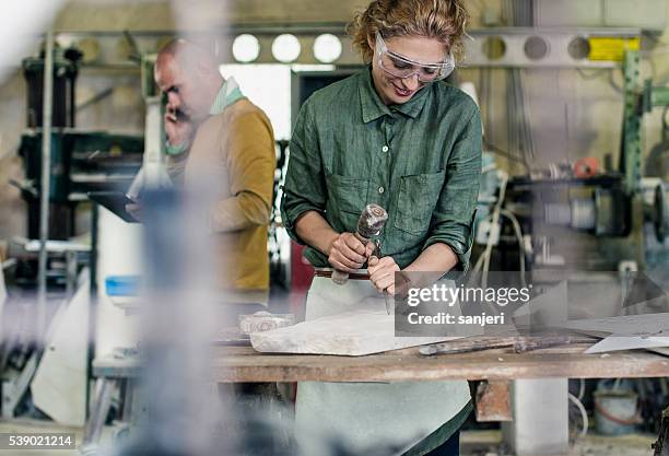 stonecutter at his workshop - sculptor stock pictures, royalty-free photos & images