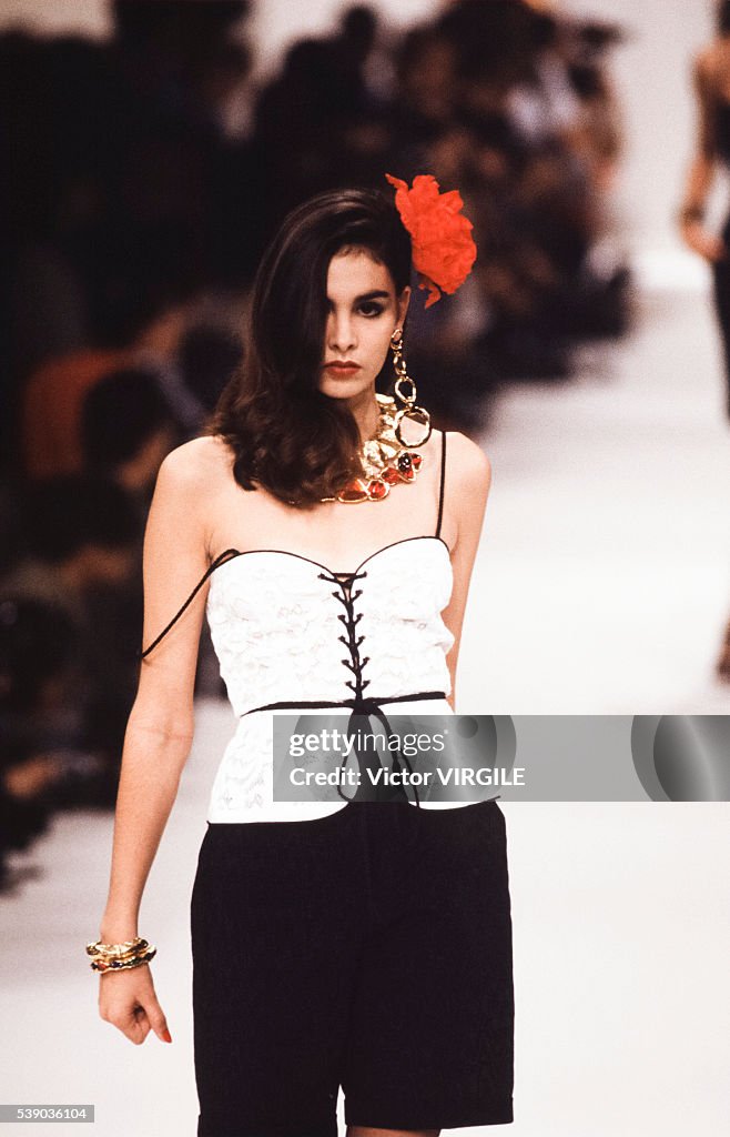 A model walks the runway at the Yves Saint Laurent Ready to Wear ...
