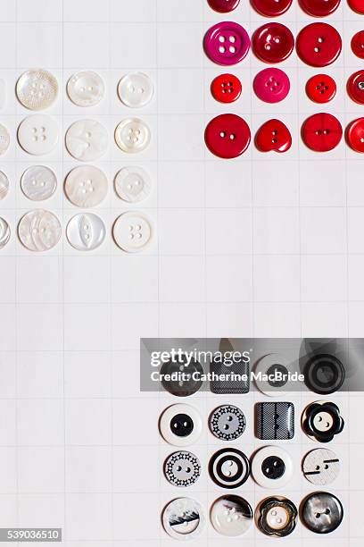 red, white and black buttons... - catherine macbride stock pictures, royalty-free photos & images