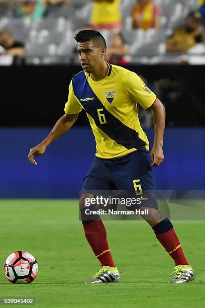 Christian Noboa of Ecuador brings the ball up field during a group B match between Ecuador and Peru at University of Phoenix Stadium as part of Copa...