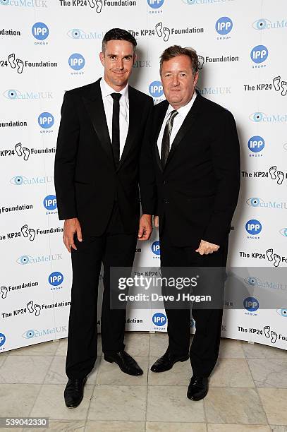 Kevin Pietersen and Piers Morgan attend The KP24 Foundation Charity Gala Dinner at The Waldorf Hilton Hotel on June 9, 2016 in London, England.