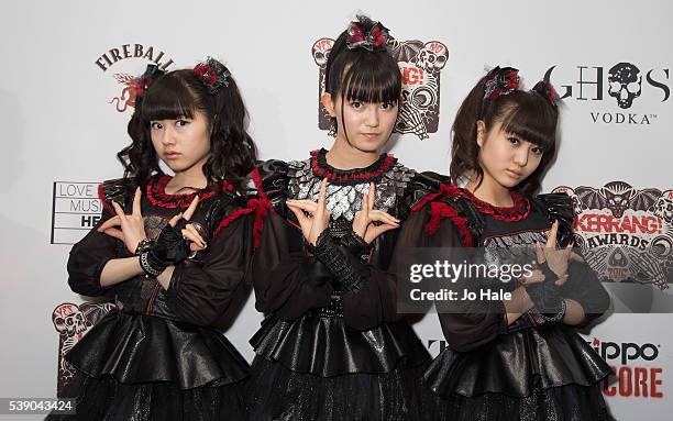 Sukuka Nakamoto 'Su-Metal', Yui Mizuno as 'Yuimetal' and Moa Kikuchi as 'Moametal' of Baby Metal attend the Kerrang Awards 2016 at the Troxy on June...