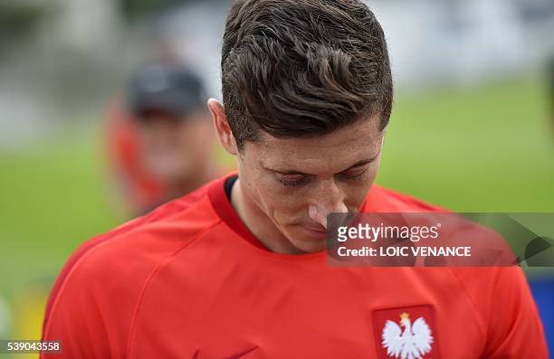 Poland's forward Robert Lewandowski is pictured as he answers questions from journalists after a training session in La Baule, on June 9 on the eve...