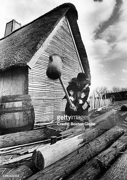 Bill Pine hammers a wedge into a log for clapboard at Plimoth Plantation in Plymouth, Mass., on Nov. 14, 1974.