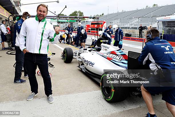 Heineken ambassador Scott Quinnell next to the Williams team during a pit stop practice during previews to the Canadian Formula One Grand Prix at...