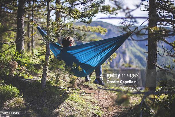 hiker in a hammock - lozere stock-fotos und bilder