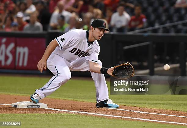 Paul Goldschmidt of the Arizona Diamondbacks catches the ball while covering first base against the Tampa Bay Rays at Chase Field on June 7, 2016 in...