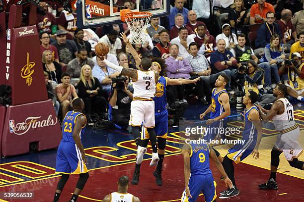 Kyrie Irving of the Cleveland Cavaliers drives to the basket against Anderson Varejao of the Golden State Warriors in Game Three of the 2016 NBA...