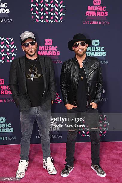 Preston Brust and Chris Lucas from musical duo LoCash attend the 2016 CMT Music awards at the Bridgestone Arena on June 8, 2016 in Nashville,...