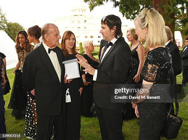 Naomie Harris, Prince Philip, Duke of Edinburgh and Neal Purvis attend the Duke of Edinburgh Award 60th Anniversary Diamonds are Forever Gala at...