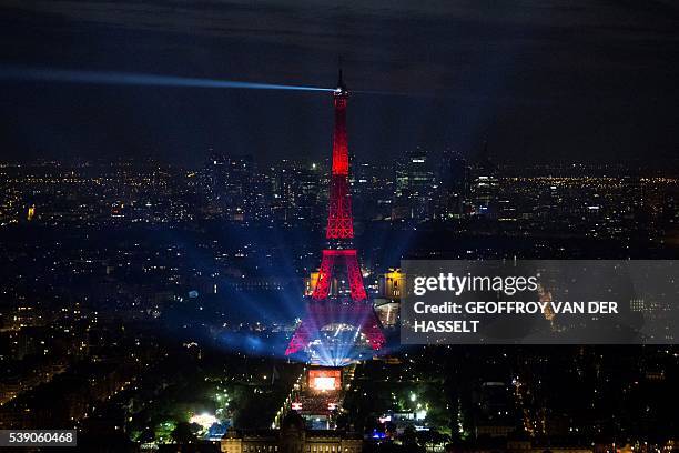 Picture taken on June 9, 2016 from the Montparnasse tower shows the opening concert of the Paris fan zone on the Champs de Mars by the Eiffel Tower,...