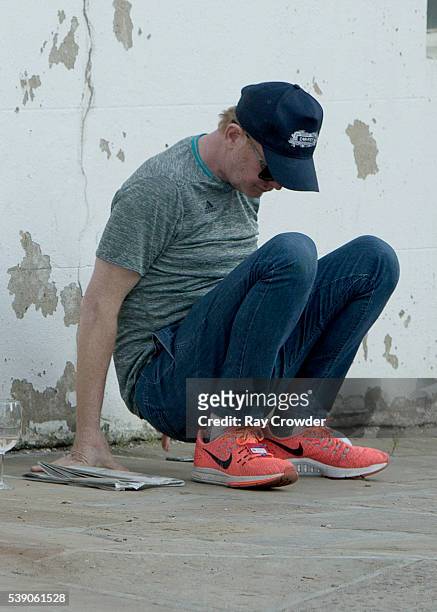 Top Gear presenter Chris Evans seen sipping wine whilst lying against a wall on JUNE 06, 2016 in London, United Kingdom.