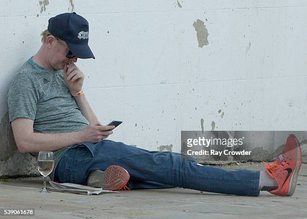 Top Gear presenter Chris Evans seen sipping wine whilst lying against a wall on JUNE 06, 2016 in London, United Kingdom.