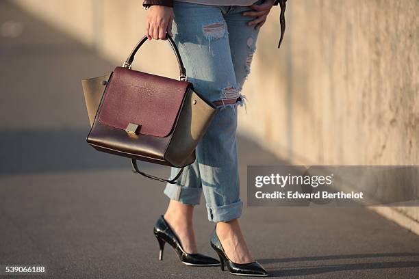 Sara Carnicella , is wearing Givenchy shoes, a Zara top, Zara jeans, a Celine Trapezio bag, and an Iro leather jacket, during a street style session,...