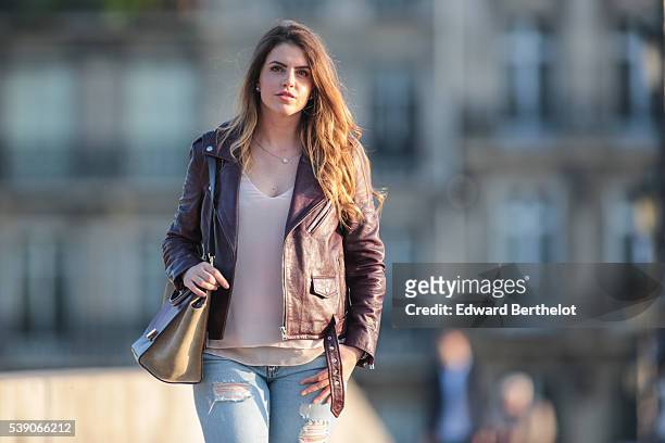 Sara Carnicella , is wearing Givenchy shoes, a Zara top, Zara jeans, a Celine Trapezio bag, and an Iro leather jacket, during a street style session,...