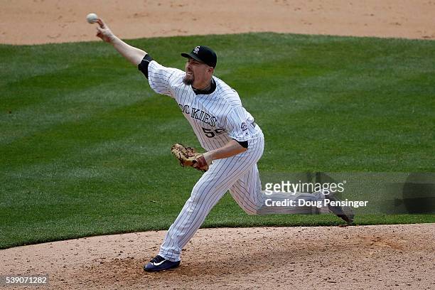Relief pitcher Chad Qualls of the Colorado Rockies deliver against the Pittsburgh Pirates in the ninth inning at Coors Field on June 9, 2016 in...