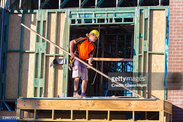 People work on new housing at North Lakes on June 10, 2016 in Brisbane, Australia. Economic forecasts suggest Brisbane is on track to overtake...