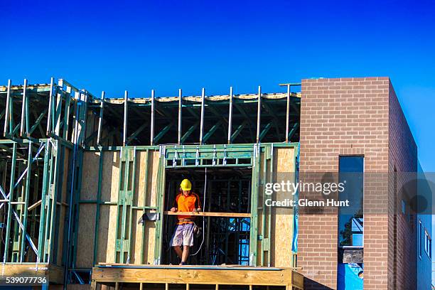 People work on new housing at North Lakes on June 10, 2016 in Brisbane, Australia. Economic forecasts suggest Brisbane is on track to overtake...