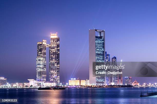 abu dhabi city skyline united arab emirates - abu dhabi buildings stock pictures, royalty-free photos & images