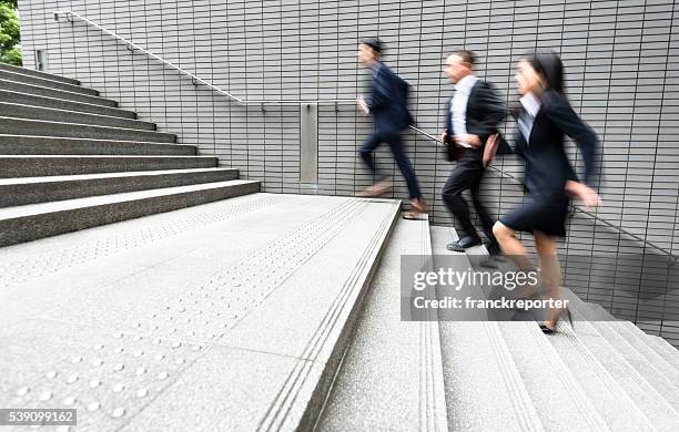 japanese business running on rush on the city - business woman working late stock pictures, royalty-free photos & images