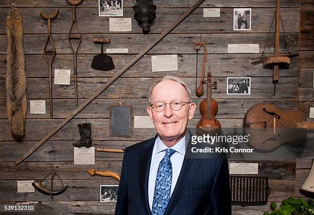 Senator Lamar Alexander poses in front of a display of Tennessee artifacts that line the walls of the lobby of his Washington DC senate office in the...
