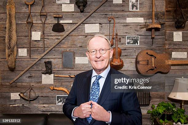 Senator Lamar Alexander poses in front of a display of Tennessee artifacts that line the walls of the lobby of his Washington DC senate office in the...