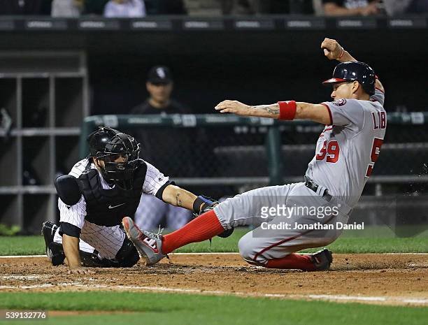 Jose Lobaton of the Washington Nationals is tagged out at the plate by Dioner Navarro of the Chicago White Sox in the 6th inning at U.S. Cellular...