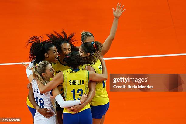 Players of Brazil celebrate after a point during the match against Italy on day 1 the FIVB Volleyball World Grand Prix at Carioca Arena 1 on June 9,...