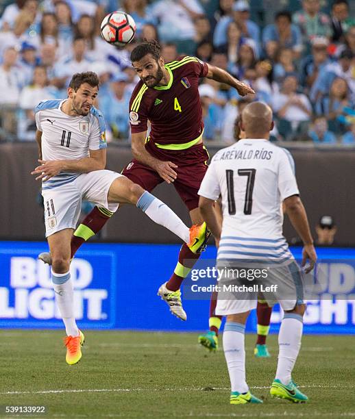 Christian Stuani of Uruguay and Oswaldo Vizcarrondo of Venezuela both go up for a header during the 2016 Copa America Centenario Group C match at...