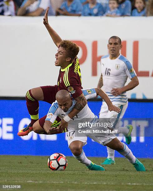 Adalberto Penaranda of Venezuela collides with Egidio Arevalo Rios of Uruguay during the 2016 Copa America Centenario Group C match at Lincoln...