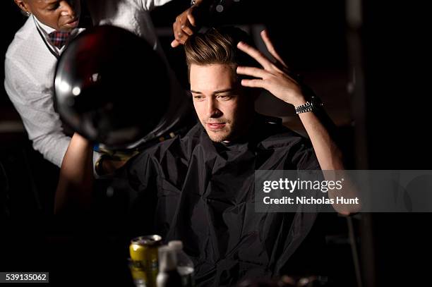 Francisco Lachowski prepares backstage at the 7th Annual amfAR Inspiration Gala at Skylight at Moynihan Station on June 9, 2016 in New York City.