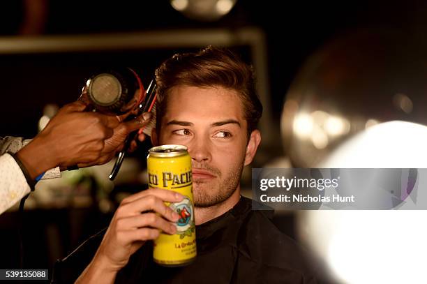 Francisco Lachowski prepares backstage at the 7th Annual amfAR Inspiration Gala at Skylight at Moynihan Station on June 9, 2016 in New York City.