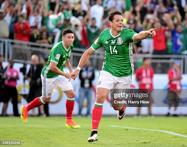 Chicharito of Mexico reacts after his goal with Hector Herrera to take a 1-0 lead over Jamaica at Rose Bowl during Copa America Centenario at the...