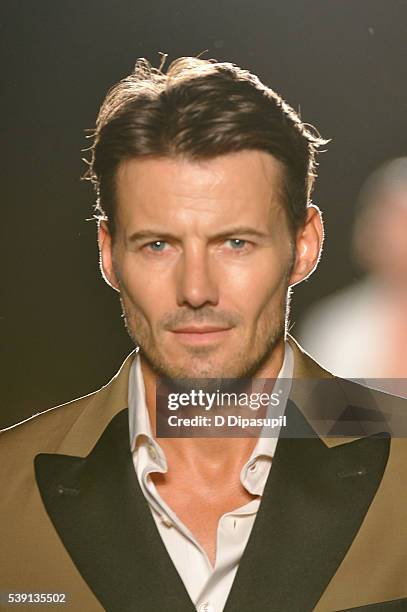 Alex Lundqvist walks the runway during the 7th Annual amfAR Inspiration Gala at Skylight at Moynihan Station on June 9, 2016 in New York City.