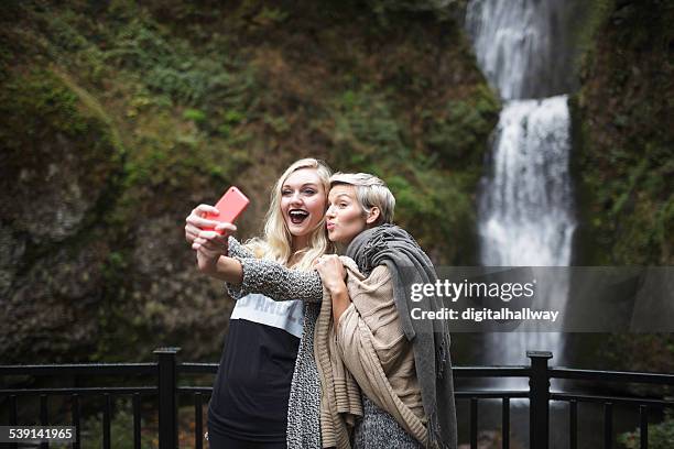 selfie two females by a waterfall - blonde woman selfie stock pictures, royalty-free photos & images