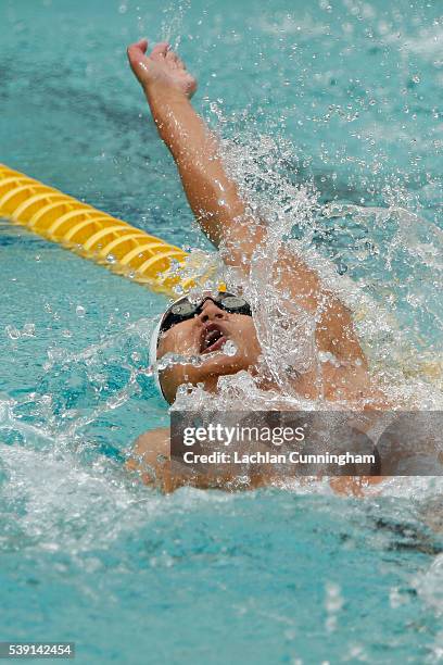 Andrew Cho swims in the heats of the 100m backstroke during day two of the 2016 Arena Pro Swim Series at George F. Haines International Swim Center...